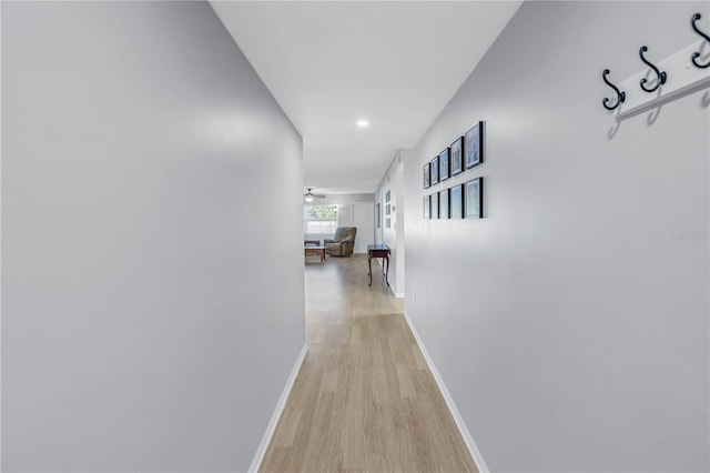 corridor with light hardwood / wood-style flooring