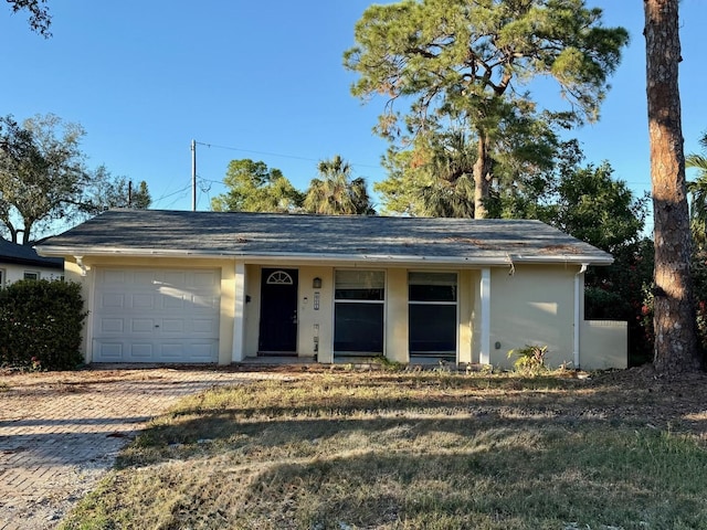 single story home with a garage