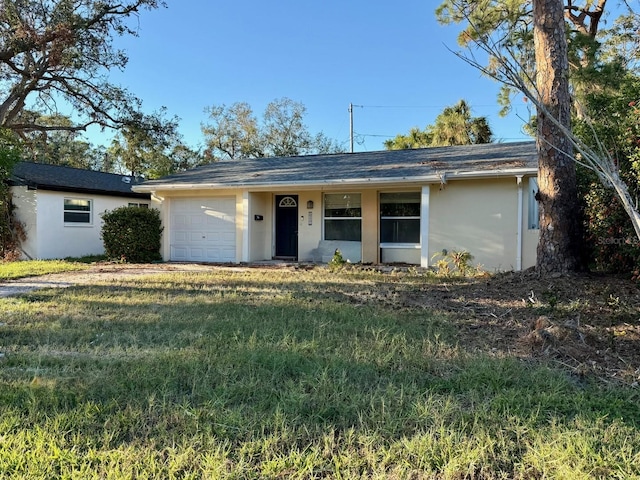 ranch-style house with a garage and a front yard