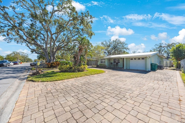 ranch-style house featuring a garage