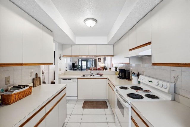 kitchen with sink, white appliances, and white cabinets