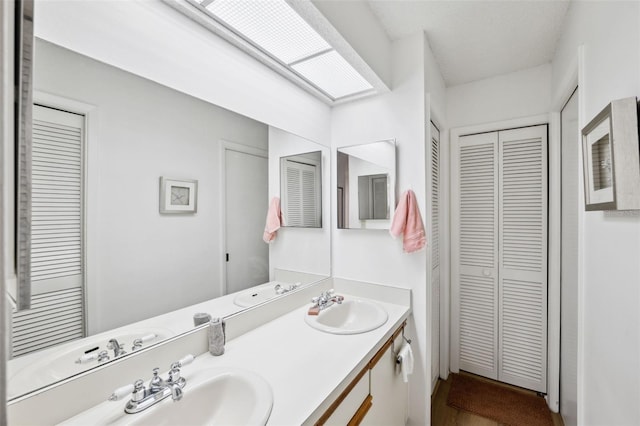 bathroom with hardwood / wood-style flooring and vanity