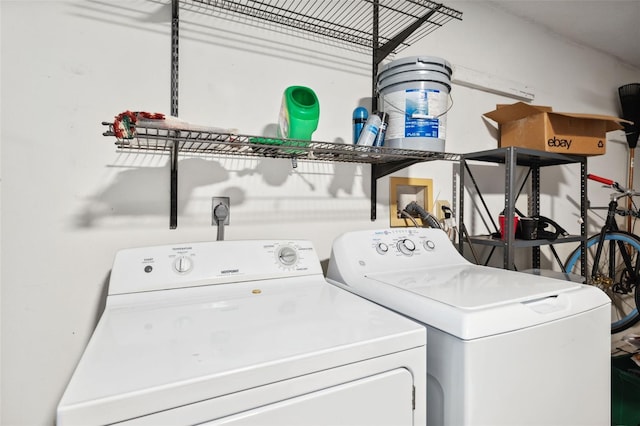 laundry area with independent washer and dryer