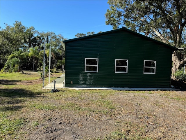 view of side of property featuring a yard