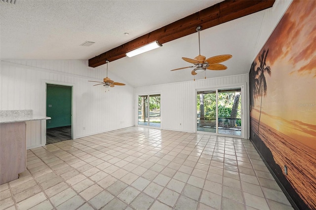 unfurnished room with ceiling fan, lofted ceiling with beams, and wood walls