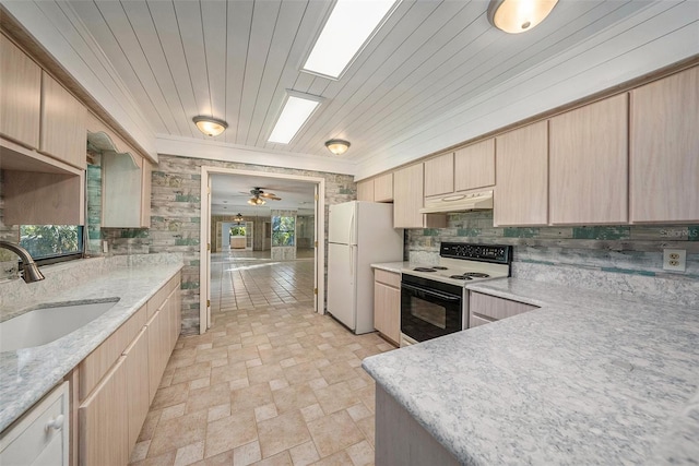 kitchen featuring white appliances, sink, decorative backsplash, ceiling fan, and light brown cabinetry