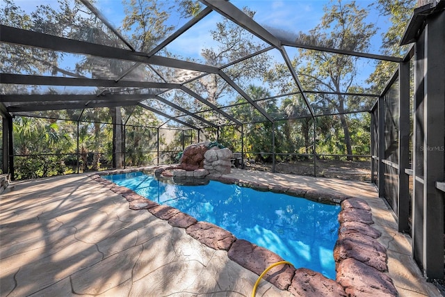 view of pool featuring a lanai and a patio