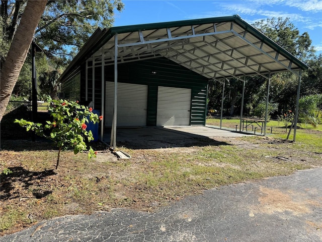 exterior space with a garage and a carport