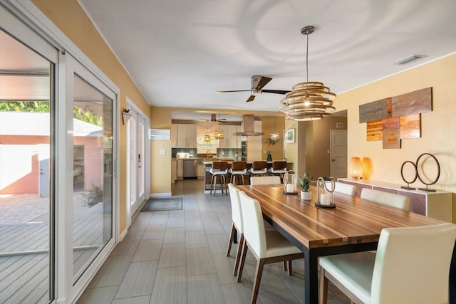 dining space with ceiling fan