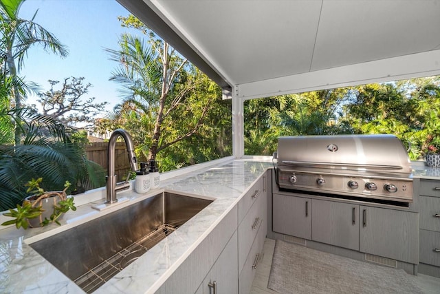 view of patio / terrace with area for grilling, grilling area, and sink