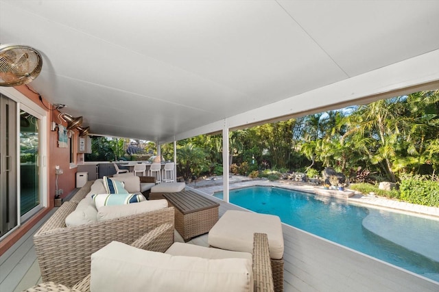 view of swimming pool with an outdoor living space