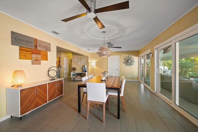 dining room featuring ceiling fan and dark hardwood / wood-style floors