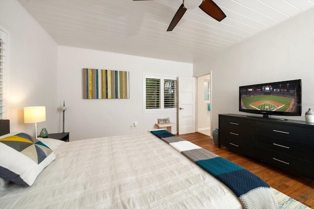 bedroom with ceiling fan and wood-type flooring