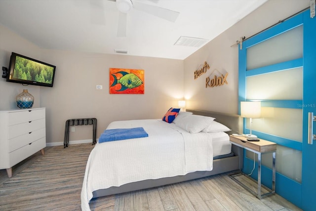 bedroom featuring ceiling fan and wood-type flooring