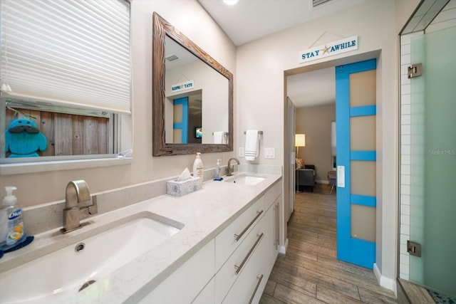 bathroom with wood-type flooring and vanity