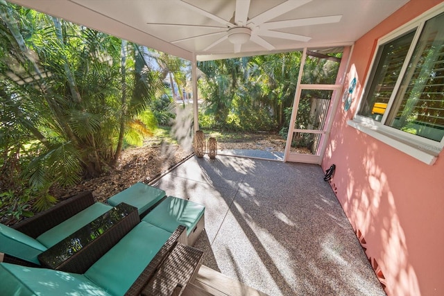 view of patio with outdoor lounge area and ceiling fan