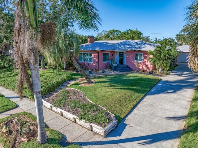 ranch-style home with a front yard