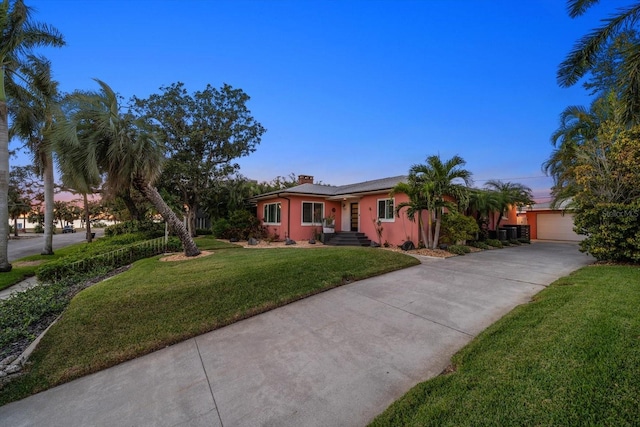 ranch-style house with a lawn