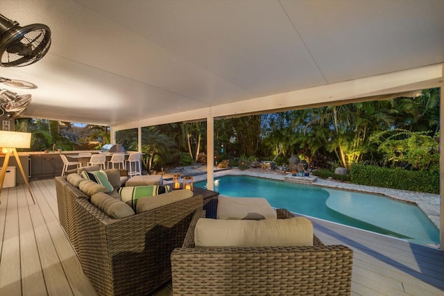 view of swimming pool featuring a wooden deck