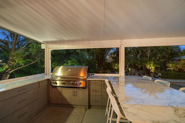 view of patio / terrace featuring area for grilling and a grill