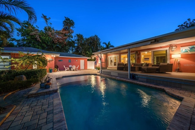 view of pool featuring an outdoor hangout area and a patio