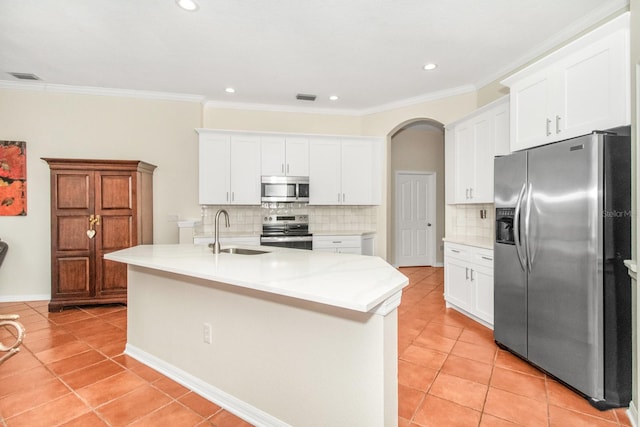 kitchen featuring sink, white cabinets, an island with sink, and appliances with stainless steel finishes