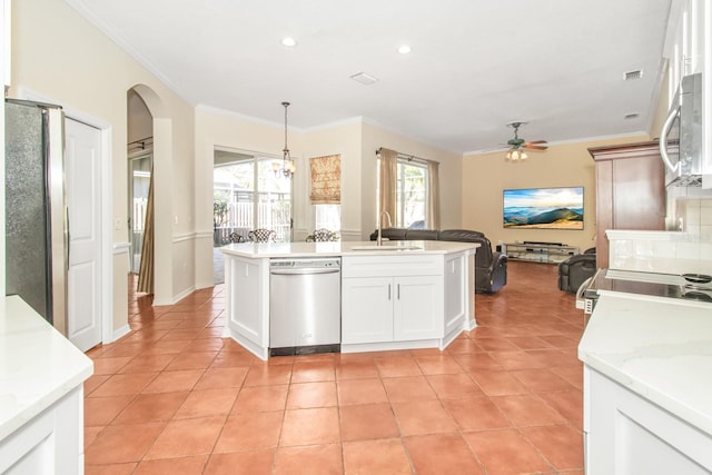 kitchen with pendant lighting, sink, stainless steel appliances, and a wealth of natural light