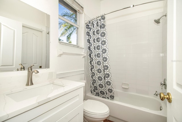 full bathroom featuring vanity, toilet, and shower / tub combo with curtain