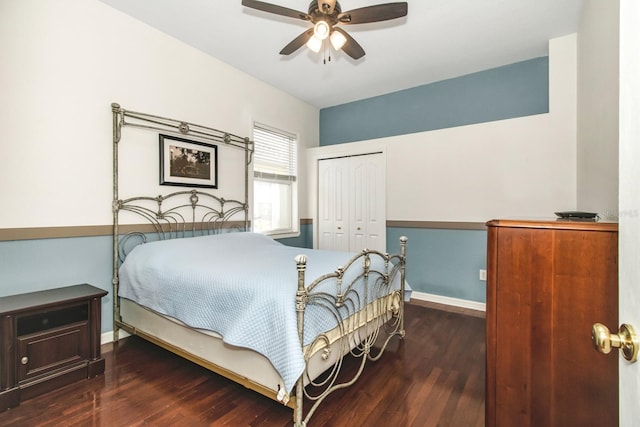 bedroom featuring ceiling fan, a closet, and dark hardwood / wood-style floors