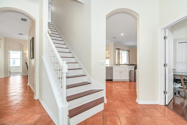 staircase with tile patterned flooring