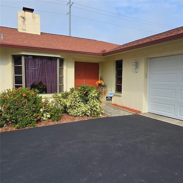 entrance to property featuring a garage