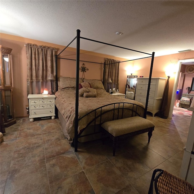 bedroom featuring a textured ceiling