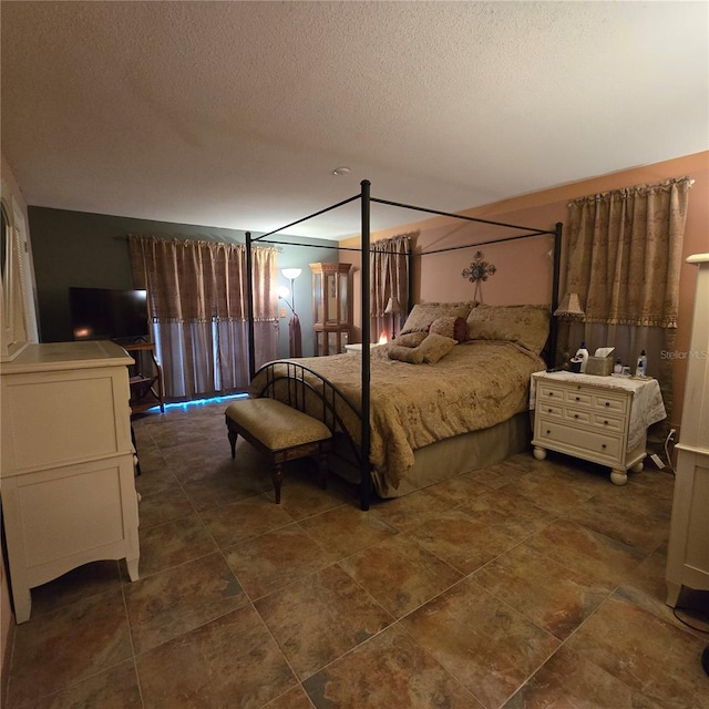 bedroom featuring a textured ceiling