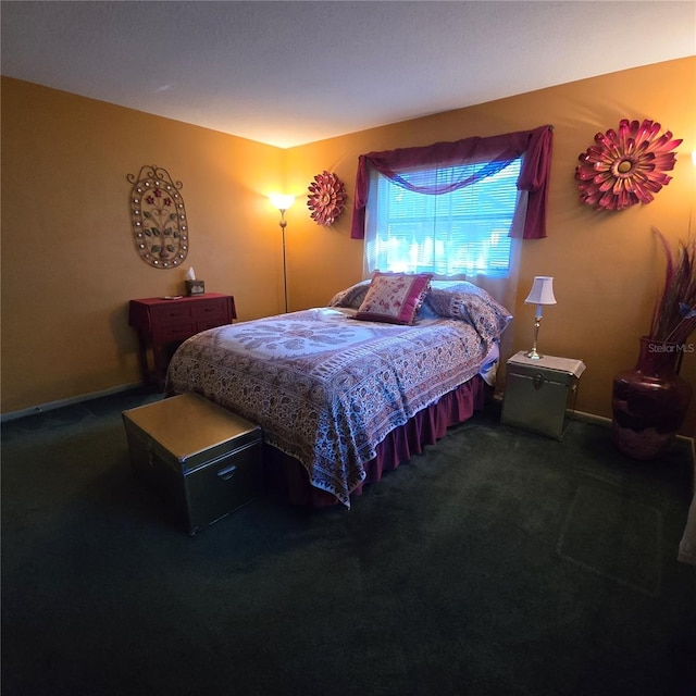 bedroom with dark carpet