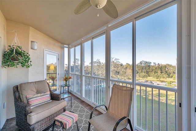 sunroom / solarium with a wealth of natural light and ceiling fan