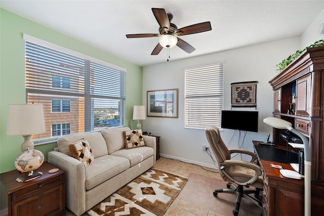 tiled office featuring ceiling fan