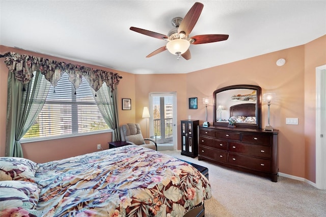 bedroom featuring light colored carpet and ceiling fan