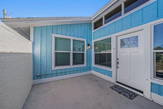 property entrance featuring a patio area