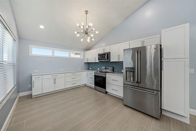 kitchen with a healthy amount of sunlight, white cabinetry, and appliances with stainless steel finishes