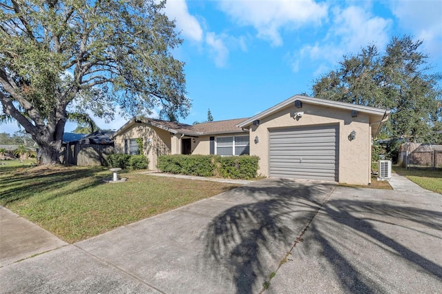 single story home with a garage, central air condition unit, and a front yard