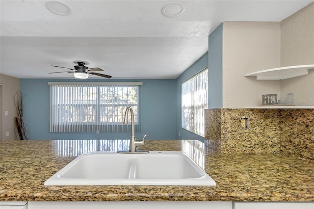 kitchen with ceiling fan and sink