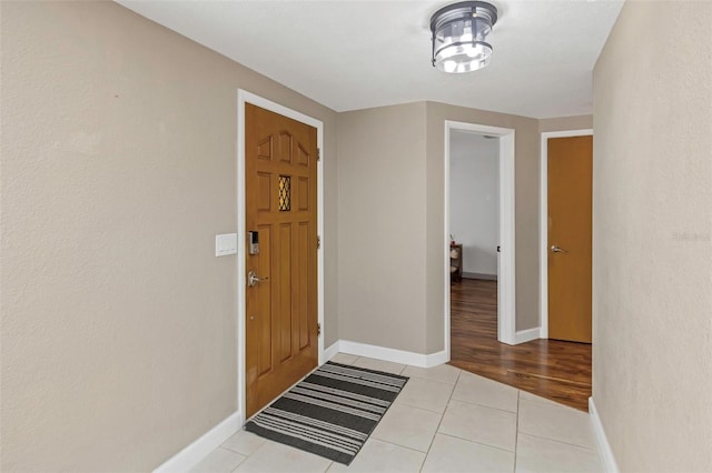 foyer entrance with light hardwood / wood-style floors