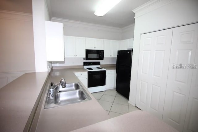 kitchen featuring sink, white cabinetry, light tile patterned floors, black appliances, and crown molding