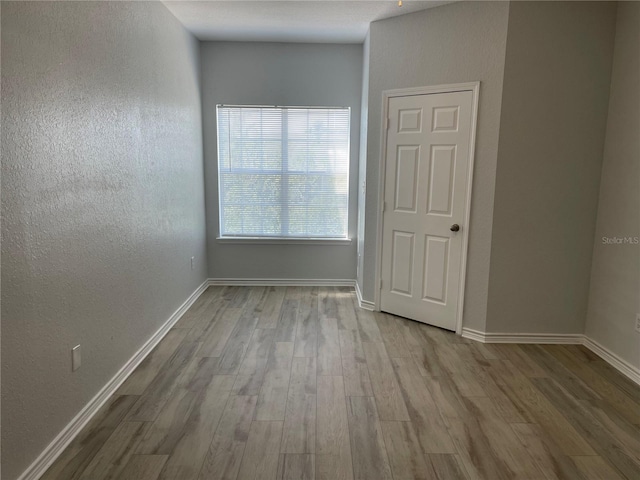 unfurnished room featuring light hardwood / wood-style floors