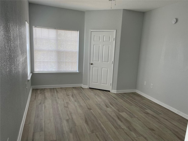 unfurnished room featuring light wood-type flooring