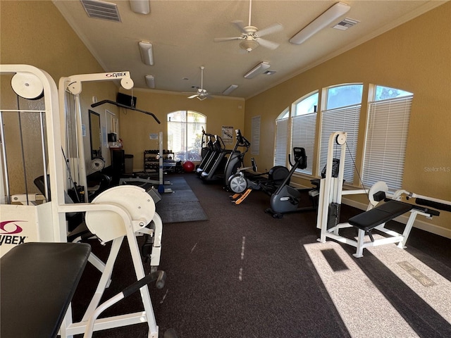 gym with ceiling fan and crown molding