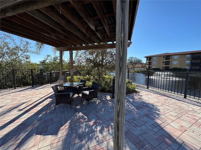 view of patio with a water view