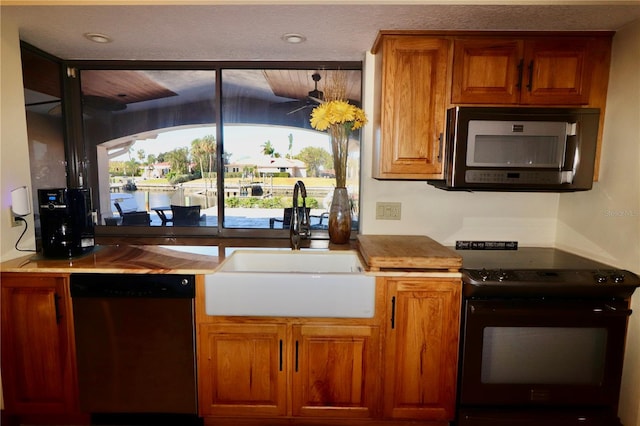 kitchen with sink and appliances with stainless steel finishes