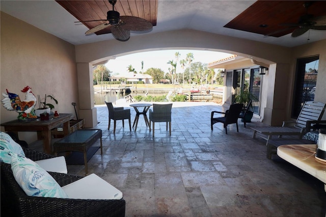 view of patio / terrace with ceiling fan and an outdoor living space