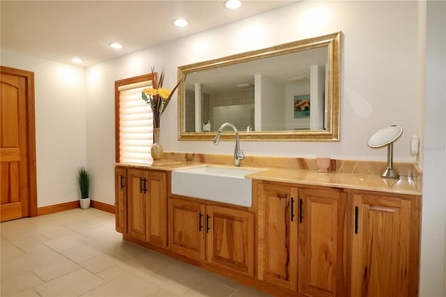 bathroom featuring tile patterned flooring and vanity